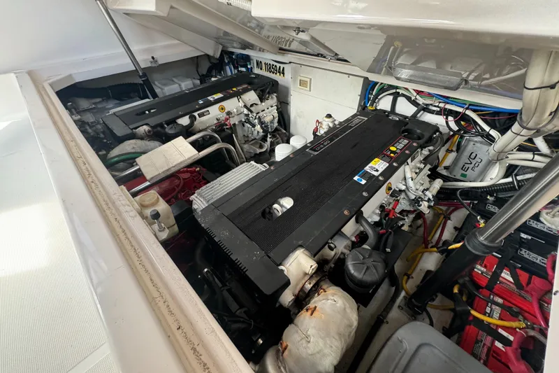 Slide: The Image of Engine compartment of a 2006 Tiara Yachts 3200 Open, showcasing dual engines and wiring. - 46