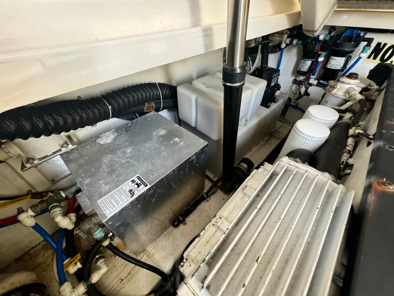 Slide: The Image of Engine compartment of 2006 Tiara Yachts 3200 Open, showcasing mechanical components and wiring. - 47