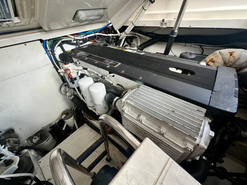 Slide: The Image of Engine compartment of a 2006 Tiara Yachts 3200 Open, showcasing detailed mechanical components. - 49