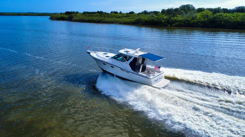 Slide: The Image of 2006 Tiara Yachts 3200 Open cruising on a scenic waterway. - 8