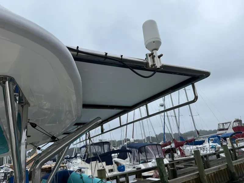 Slide: The Image of Inflatable boat with motor cover on Leopard 48 yacht, docked at marina, 2013 model. - 11