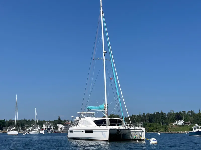 Slide: The Image of Compact bathroom in 2013 Leopard 48 yacht, featuring sink, toilet, and window. - 114