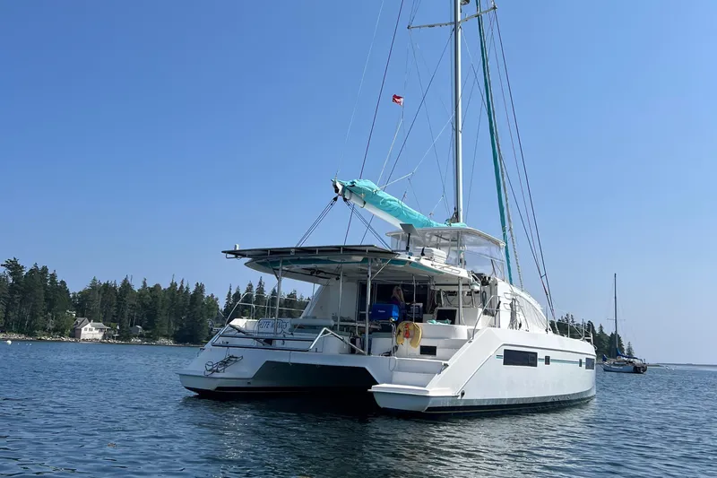 Slide: The Image of Cozy bedroom in 2013 Leopard 48 yacht with colorful pillows and natural light. - 118
