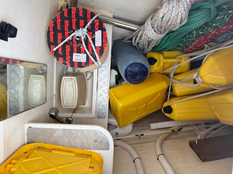 Slide: The Image of Interior seating area on a 2013 Leopard 48 yacht with teal cushions and a white table. - 12