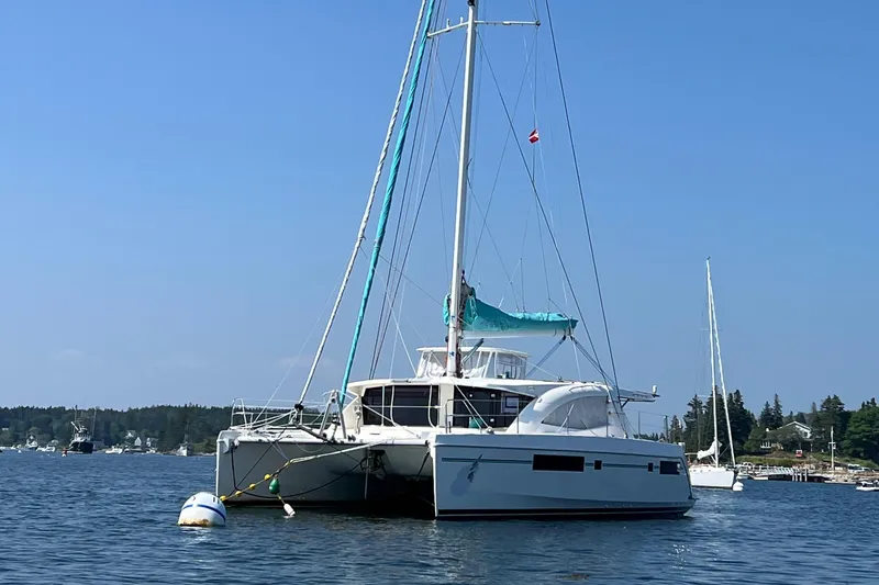 Slide: The Image of Interior of 2013 Leopard 48 yacht with wooden finishes and visible laundry area. - 122