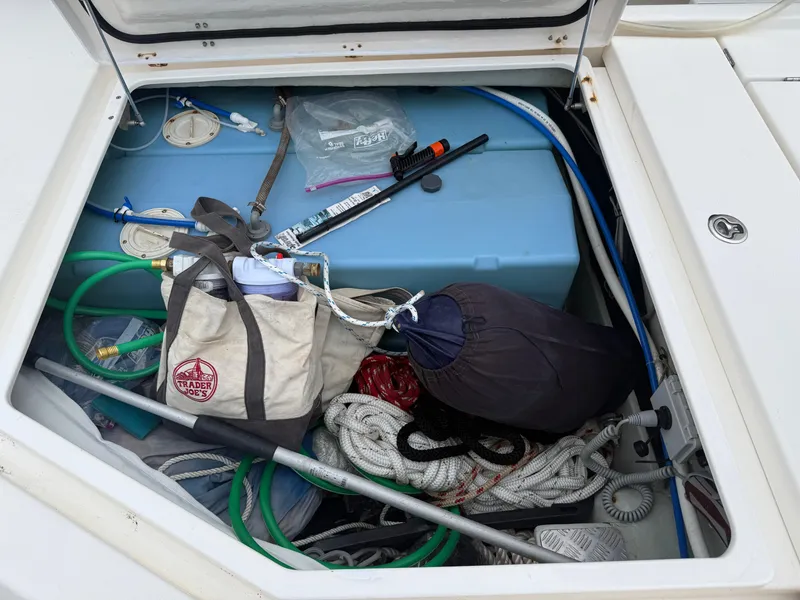 Slide: The Image of Leopard 48 yacht with solar panel and antenna, docked at marina, overcast sky. - 15