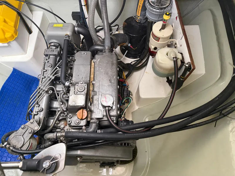 Slide: The Image of Engine compartment of a 2013 Leopard 48 yacht, showcasing mechanical components and wiring. - 19