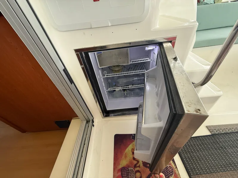 Slide: The Image of Engine compartment of a 2013 Leopard 48 yacht, featuring wiring and components. - 22