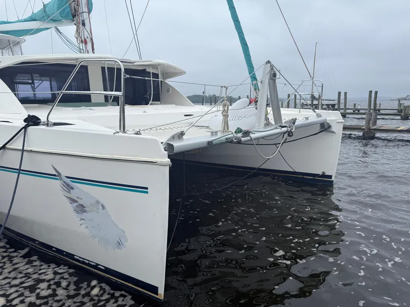 Slide: The Image of Spacious seating area on a 2013 Leopard 48 yacht, docked in a marina. - 3