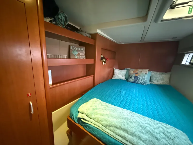 Slide: The Image of Compact bathroom in a 2013 Leopard 48 yacht with decorative curtain and modern fixtures. - 32