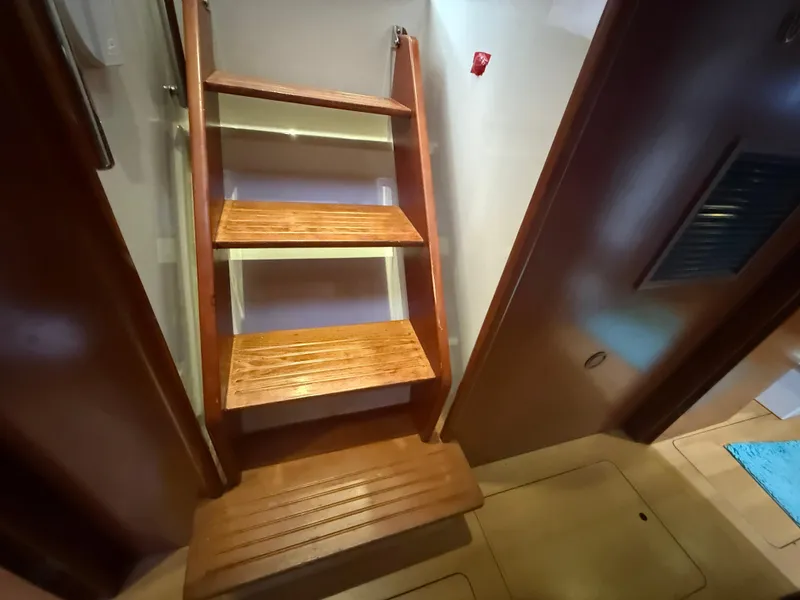 Slide: The Image of Compact bathroom in a 2013 Leopard 48 yacht, featuring modern fixtures and a small window. - 37