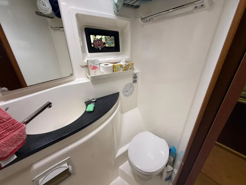 Slide: The Image of Interior hallway of 2013 Leopard 48 yacht with wooden doors and flooring. - 38