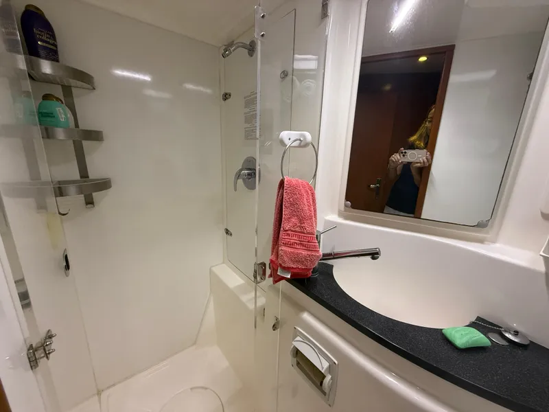 Slide: The Image of Wooden stairs inside a 2013 Leopard 48 yacht, leading to the cabin area. - 39