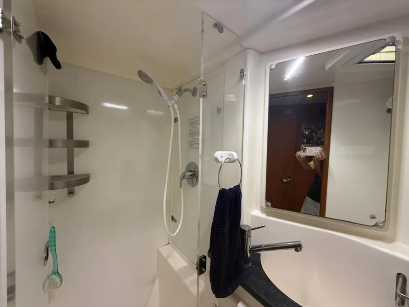 Slide: The Image of Luxurious bathroom in 2013 Leopard 48 yacht with modern fixtures and elegant design. - 45