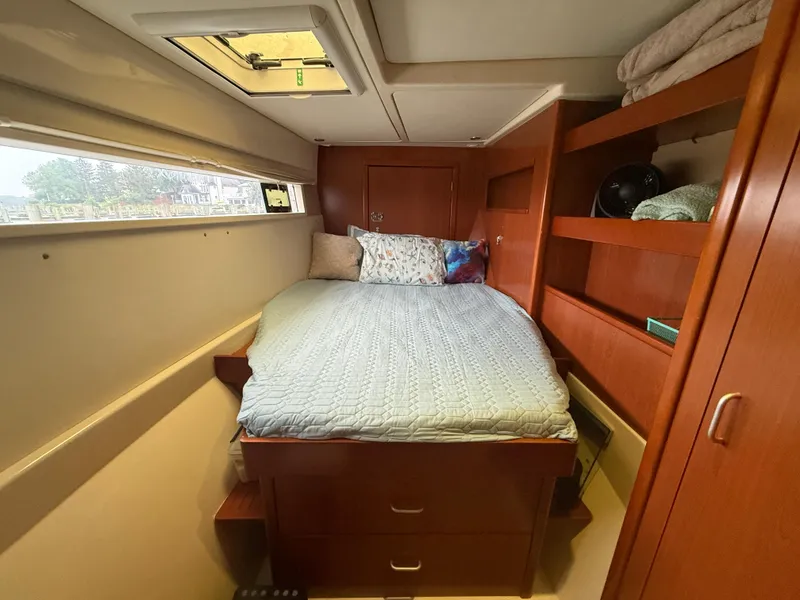 Slide: The Image of Leopard 48 yacht interior, 2013 model, featuring spacious seating and marina view. - 49