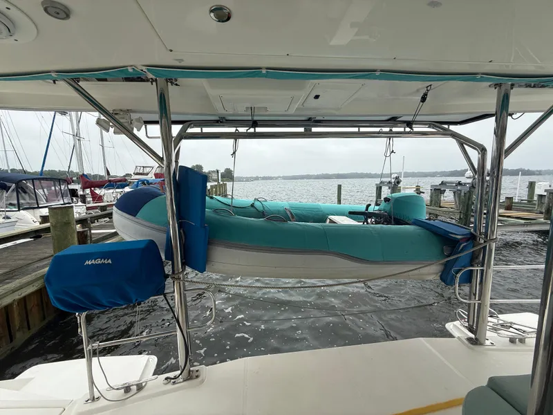 Slide: The Image of Luxurious interior of 2013 Leopard 48 yacht with cozy seating and elegant wooden table. - 5