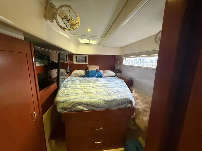 Slide: The Image of Luxurious 2013 Leopard 48 yacht interior with modern kitchen and spacious seating area. - 56