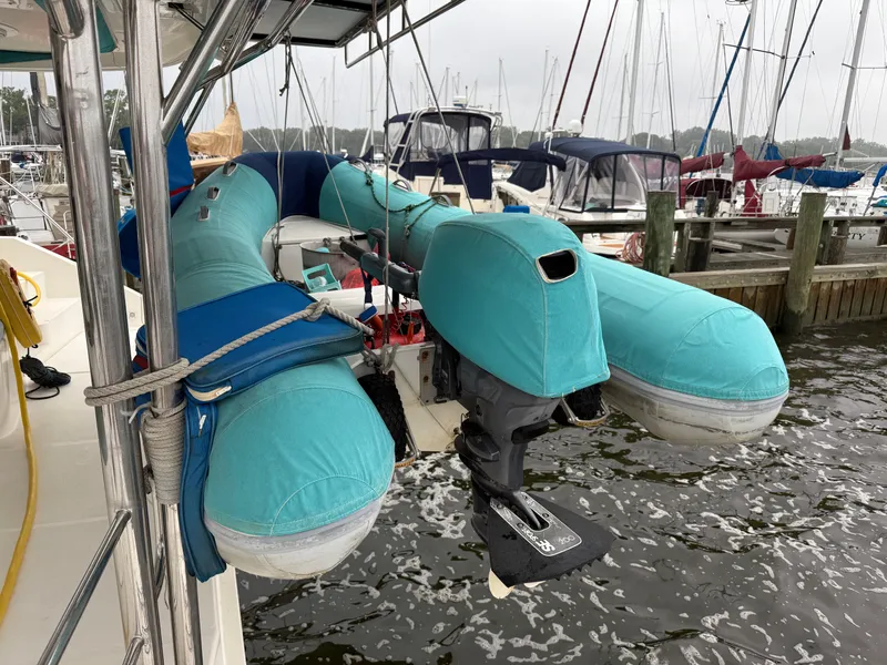 Slide: The Image of Modern kitchen in a 2013 Leopard 48 yacht with wood cabinetry and black countertops. - 6