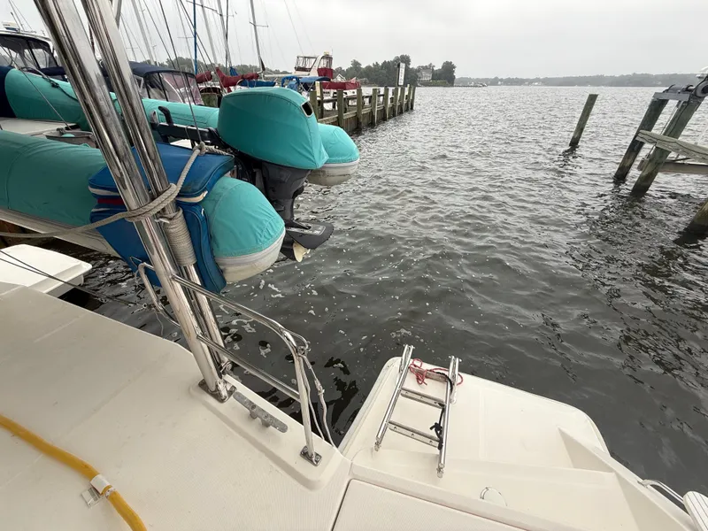 Slide: The Image of Cozy cabin interior of 2013 Leopard 48 yacht with single bed and wooden shelves. - 7