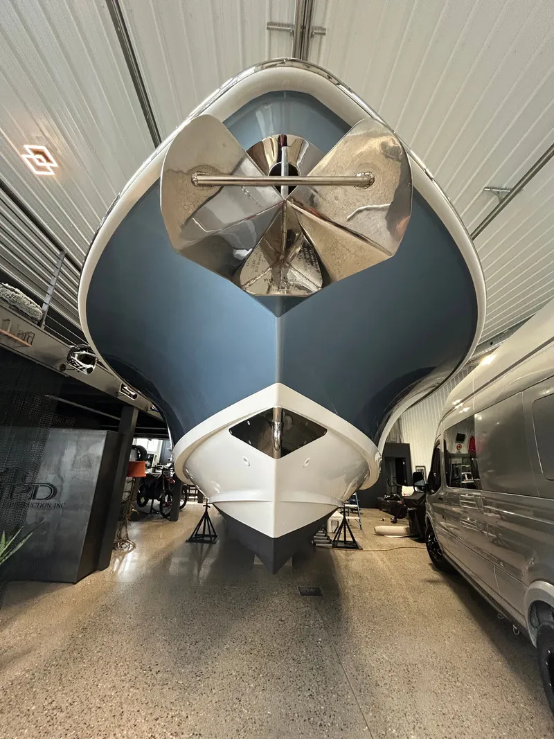 Slide: The Image of 2019 Boston Whaler 380 Outrage in a garage, front view. - 50