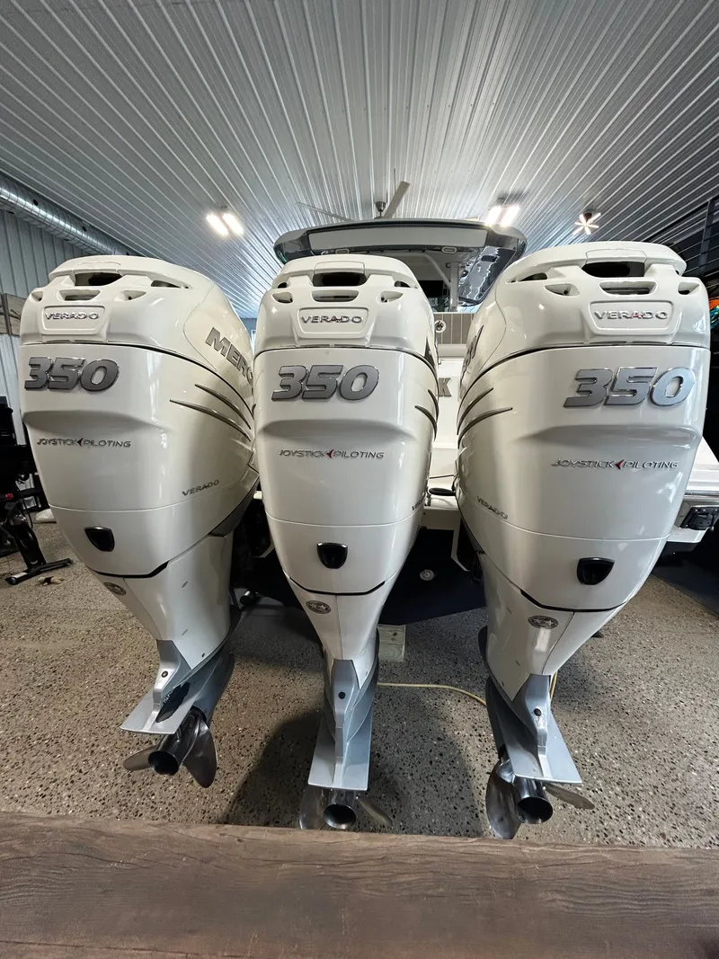 Slide: The Image of Three Mercury Verado 350 engines on a 2019 Boston Whaler 380 Outrage. - 52