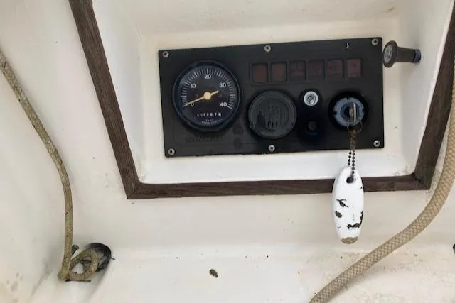 Slide: The Image of Control panel of a 1981 J Boats 30 sailboat with key and ropes. - 6