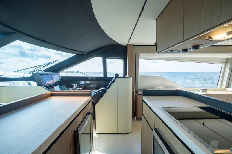 Slide: The Image of Luxurious interior of 2024 Ferretti Yachts 720 with modern kitchen and ocean view. - 40