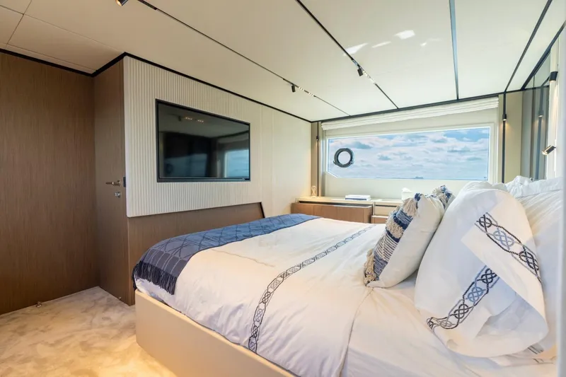 Slide: The Image of Luxurious bedroom interior of 2024 Ferretti Yachts 720 with ocean view window. - 46