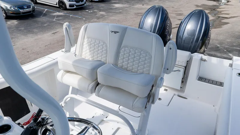 Slide: The Image of 2026 Tidewater 256 CC Adventure boat with dual engines and luxurious seating. - 10