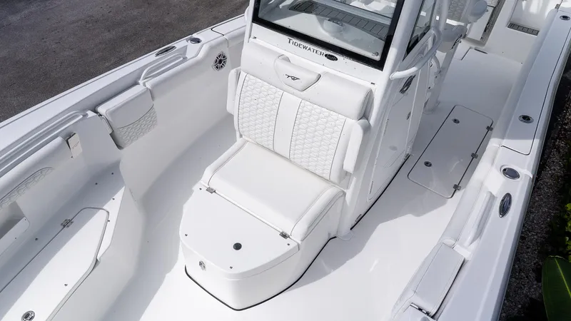 Slide: The Image of 2026 Tidewater 256 CC Adventure boat interior with white seating and modern design. - 20