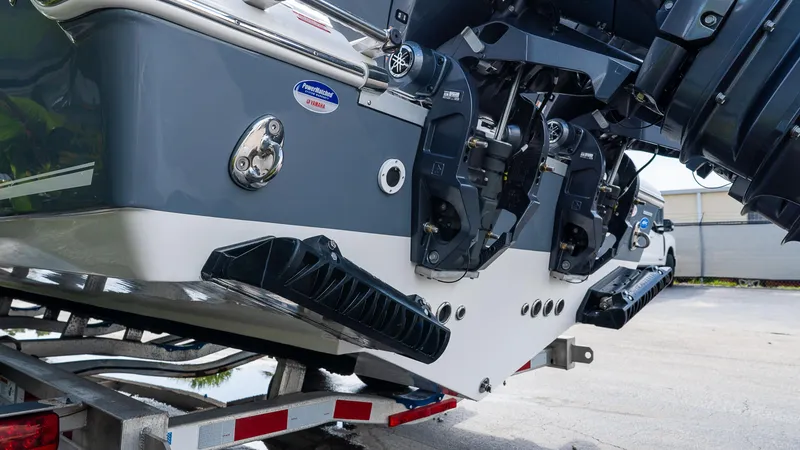 Slide: The Image of 2026 Tidewater 256 CC Adventure boat on trailer, showcasing powerful outboard motors. - 4