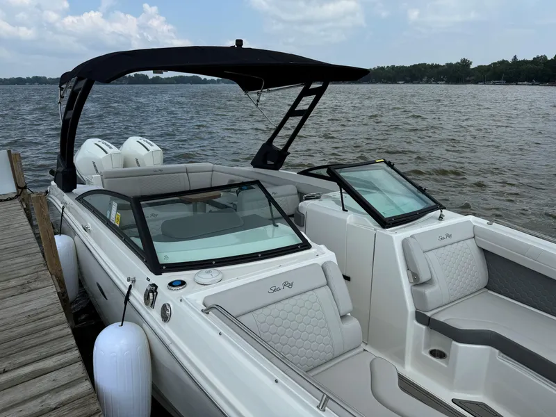 The Image of 2023 Sea Ray SDX 290 Outboard boat on water under clear blue sky. - 0