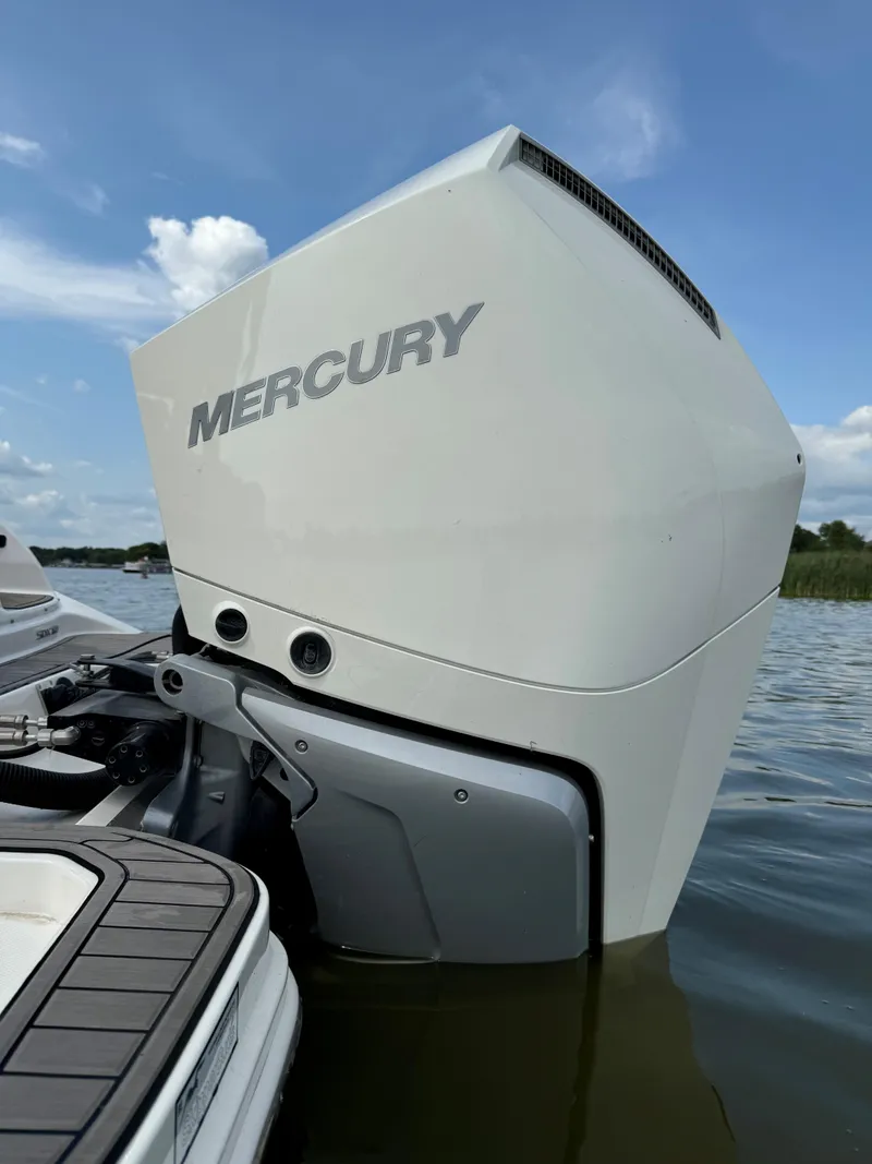 Slide: The Image of 2023 Sea Ray SDX 290 Outboard with Mercury engine on calm water. - 11