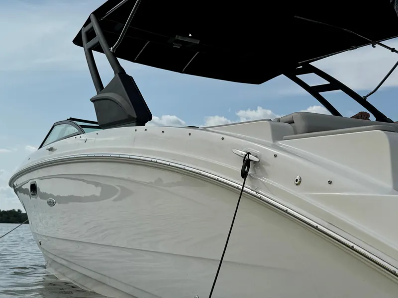 Slide: The Image of 2023 Sea Ray SDX 290 Outboard interior with orange Sea Ray cushion. - 5