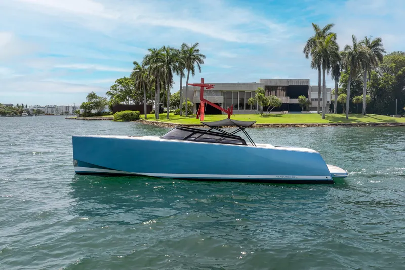 The Image of 2018 VanDutch 30 yacht on water, modern design, palm trees in background. - 0
