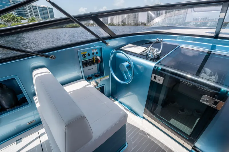 Slide: The Image of Interior of a 2018 VanDutch 30 yacht with modern controls and sleek design. - 19