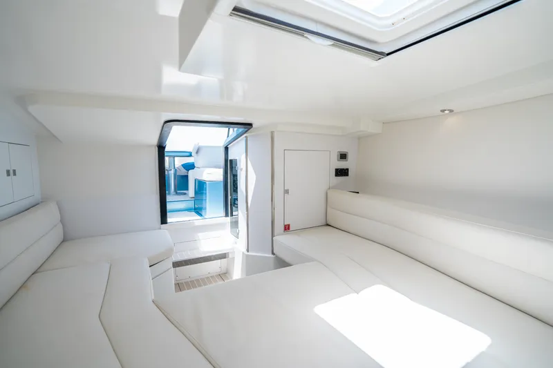 Slide: The Image of Luxurious interior of 2018 VanDutch 30 yacht with sleek white seating and modern design. - 26