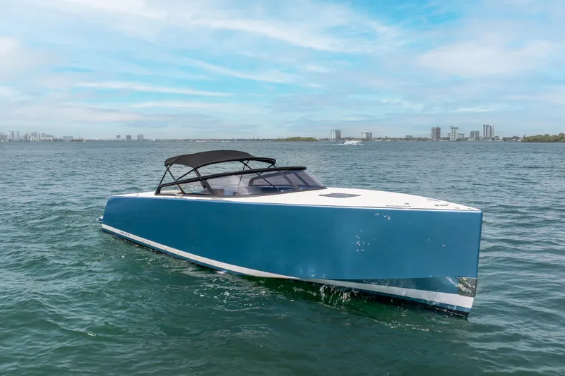 Slide: The Image of 2018 VanDutch 30 yacht on open water with city skyline in background. - 3