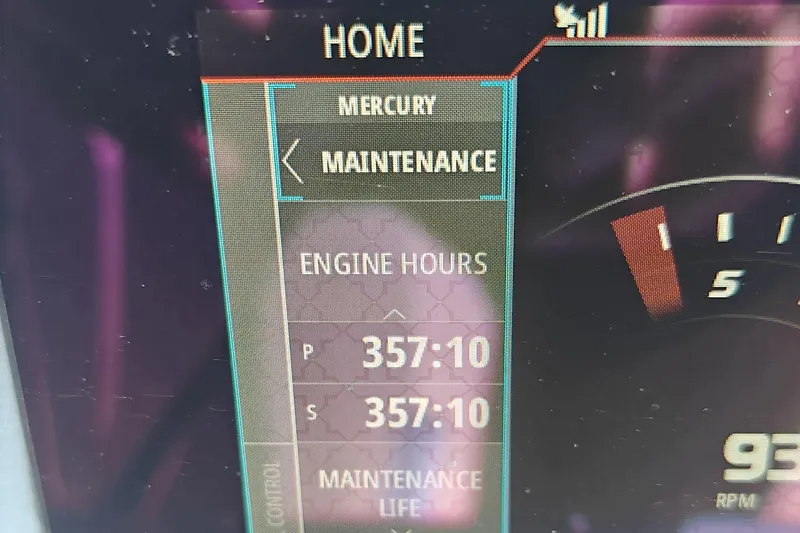 Slide: The Image of Dashboard display showing engine hours and maintenance for 2018 VanDutch 30. - 31