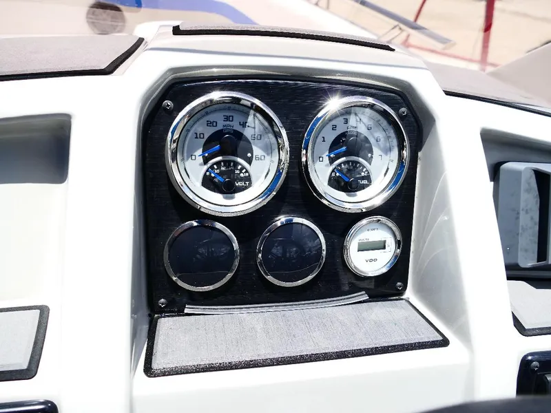 Slide: The Image of Dashboard of 2021 Starcraft SVX 211 OB boat with gauges and controls. - 11