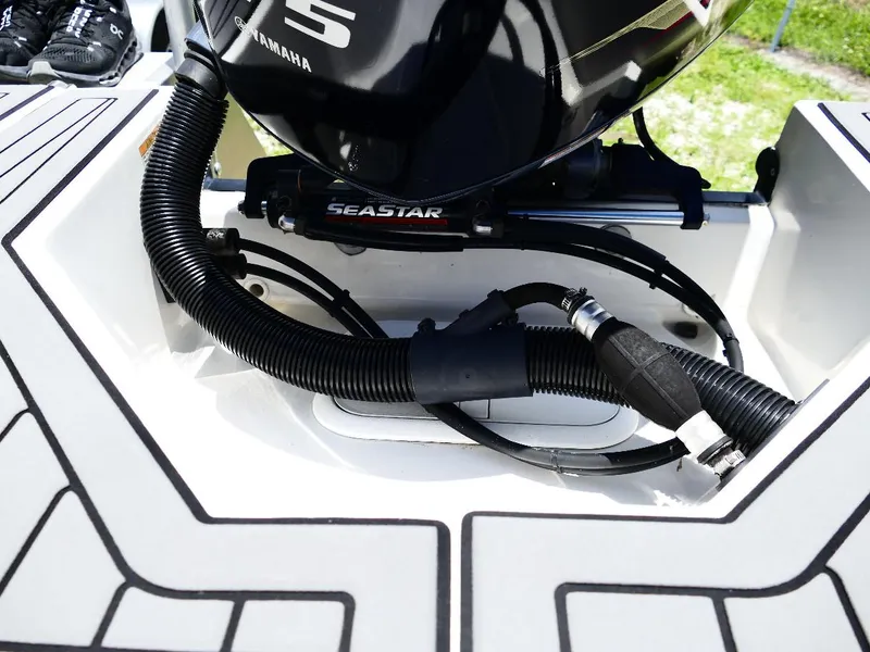 Slide: The Image of 2021 Starcraft SVX 211 OB boat engine area with Yamaha motor and Seastar components. - 23