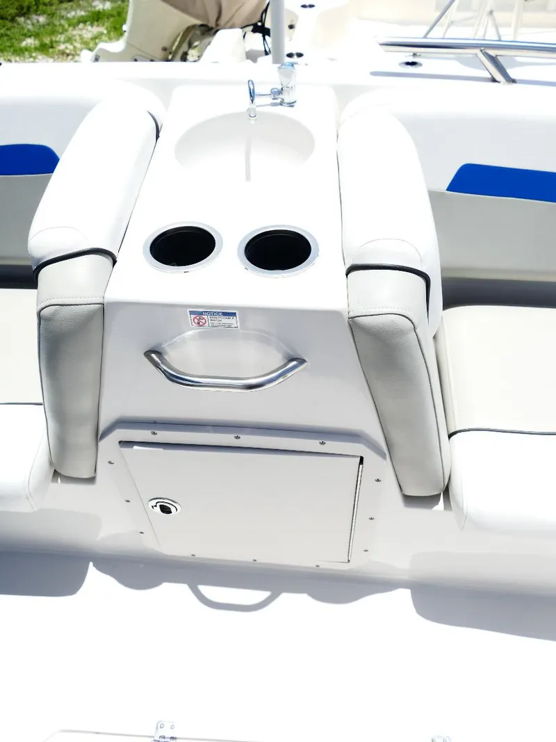 Slide: The Image of 2021 Starcraft SVX 211 OB boat interior with cup holders and storage compartment. - 28