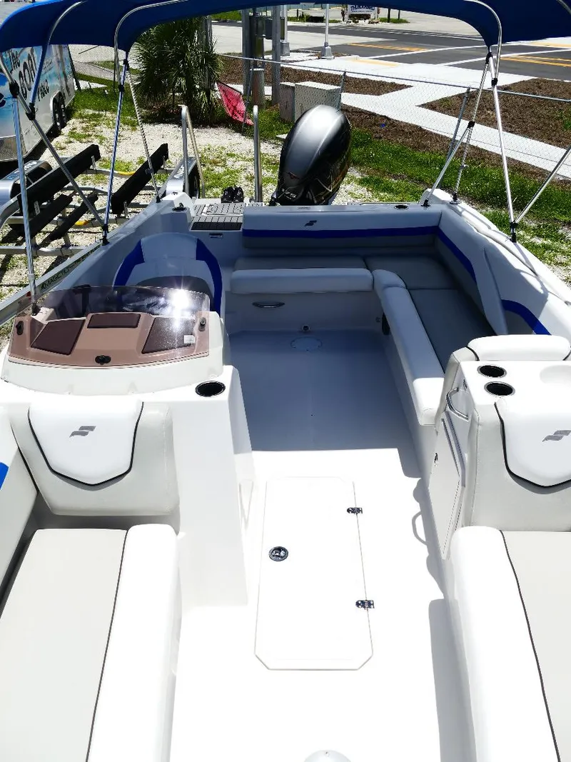 Slide: The Image of 2021 Starcraft SVX 211 OB boat interior with seating and canopy. - 30