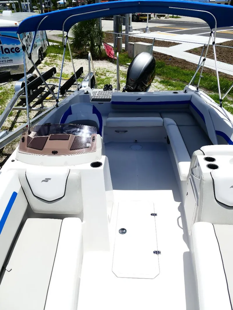 Slide: The Image of 2021 Starcraft SVX 211 OB boat interior with seating and canopy. - 31