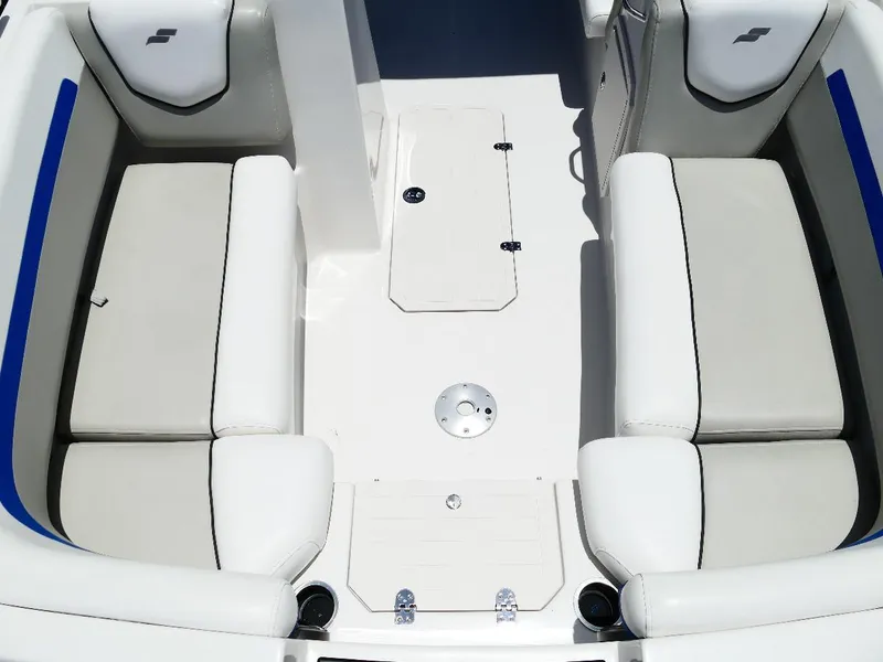 Slide: The Image of 2021 Starcraft SVX 211 OB boat interior with white seating and storage compartments. - 32