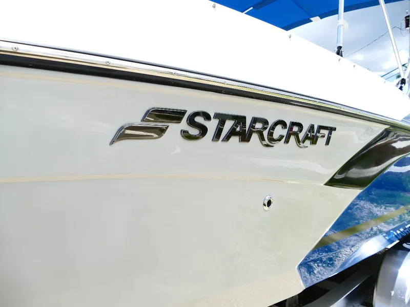 Slide: The Image of 2021 Starcraft SVX 211 OB boat side view with logo detail. - 8