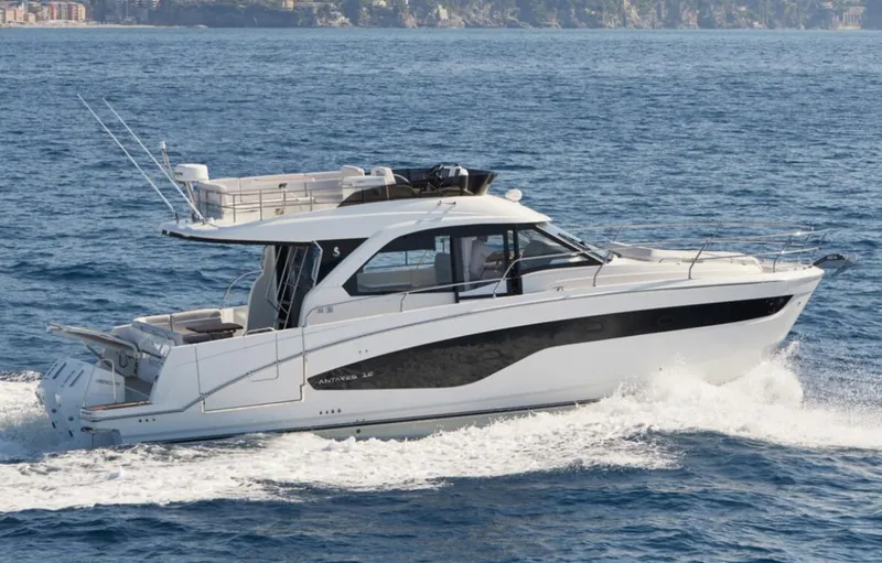 Slide: The Image of 2025 Beneteau Antares 12 cruising on open water, side view. - 7