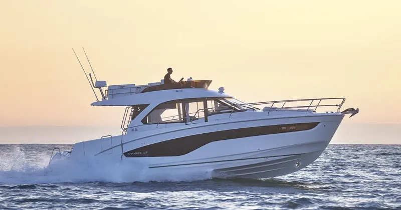 Slide: The Image of 2025 Beneteau Antares 12 yacht cruising on the ocean at sunset. - 8