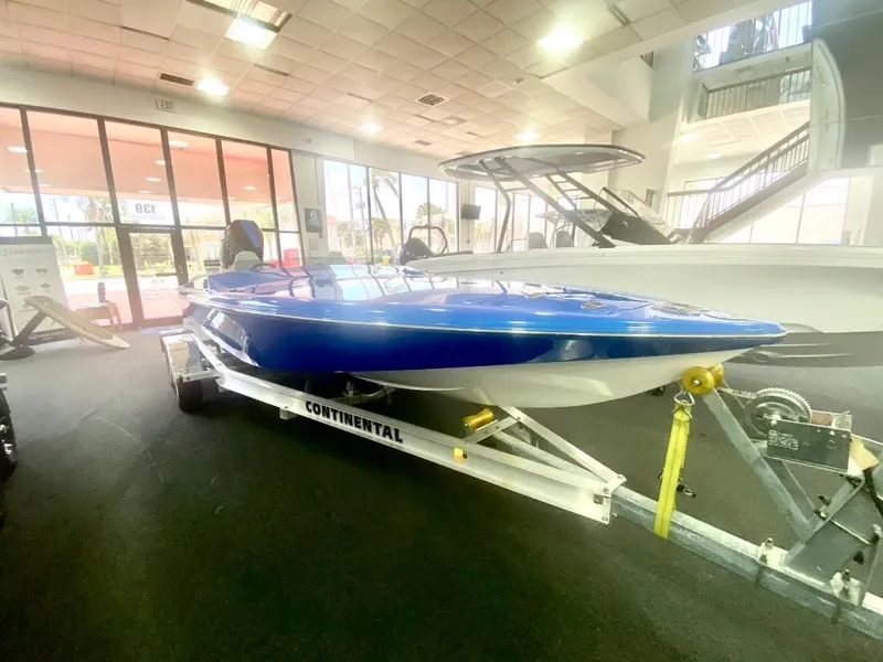 Slide: The Image of 2023 Active Thunder 22 Banshee boat on trailer in showroom. - 4