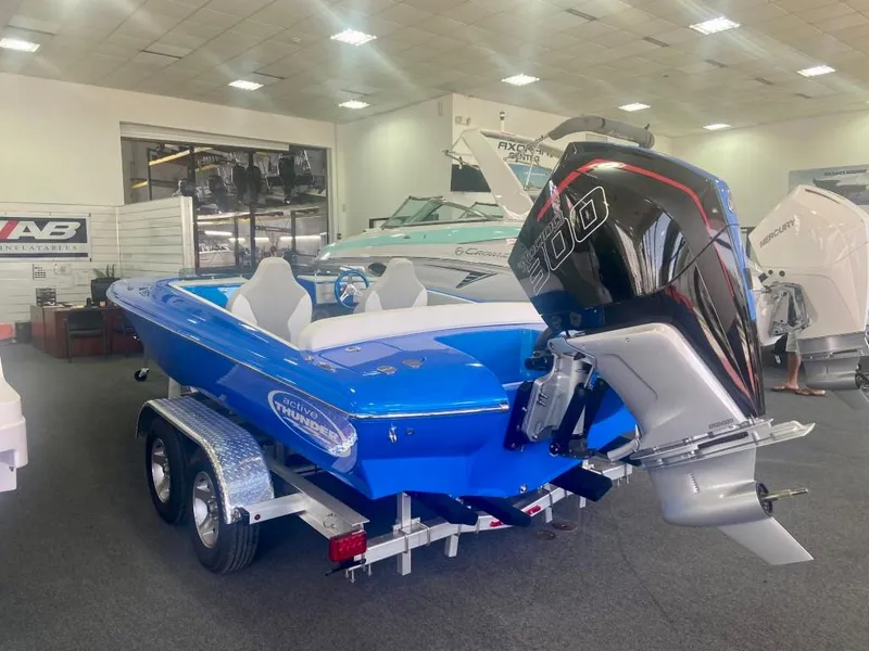 Slide: The Image of 2023 Active Thunder 22 Banshee boat with powerful outboard motor in showroom. - 8